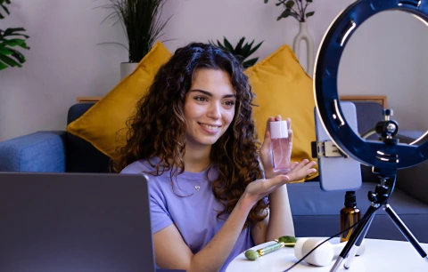 Affiliate creator with ring light at home