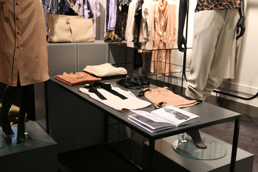 A picture containing clothes in a store
